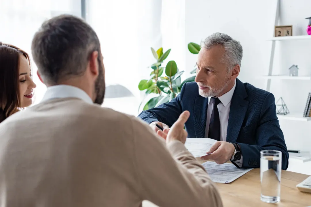 A family talking to a bail bondsman