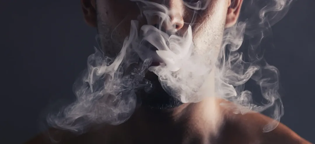 smoke cloud face man with pollution marijuana smoker health campaign with zoom cannabis weed cbd addiction model smoking habit lifestyle advertising black studio - Does Smoking