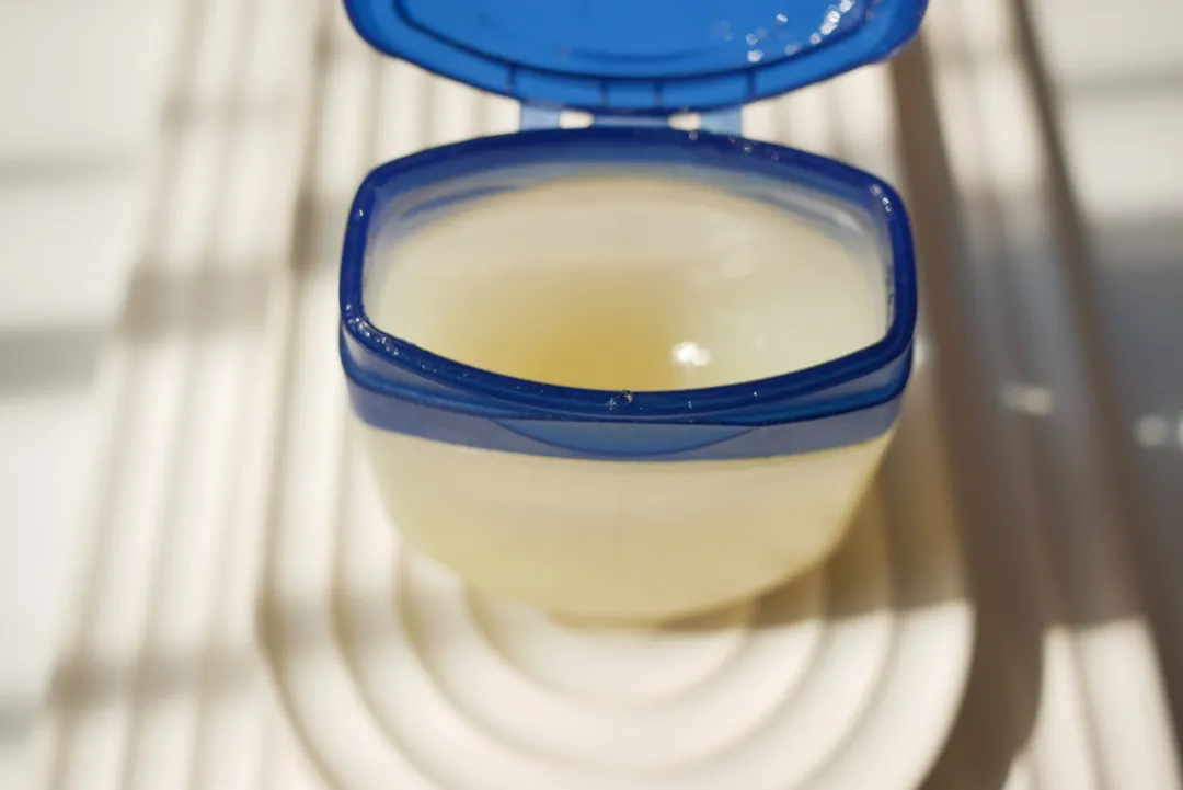 Close up of petroleum jelly in a container - Is Vaseline Good for Eczema? Benefits, Drawbacks & Best Ways To Use it - Palm Beach Dermatology Group